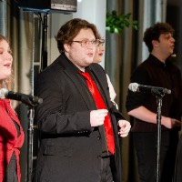 A choir singing on stage